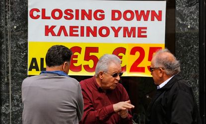 Cypriot shop owners chat about the disturbing financial state of Cyprus, March 22.