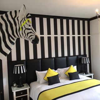 bedroom with black and white stripes wall