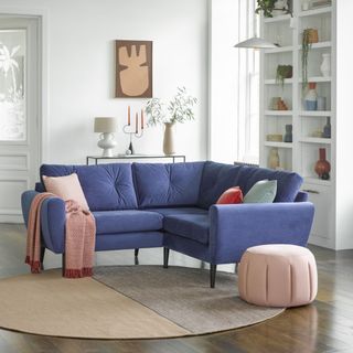 A blue corner sofa in a modern living room