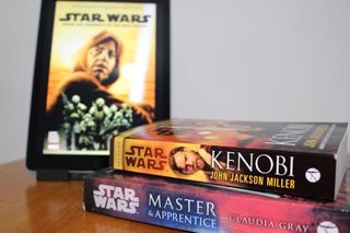 From the Journals of Obi-Wan Kenobi displayed on an iPad with Kenobi and Master and Apprentice books in foreground