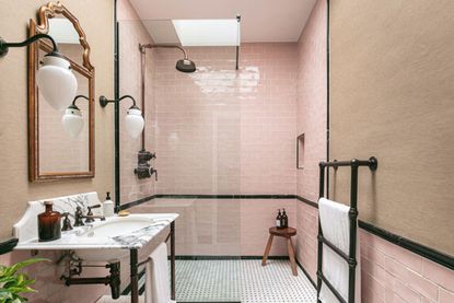 A pink and black tiled bathroom