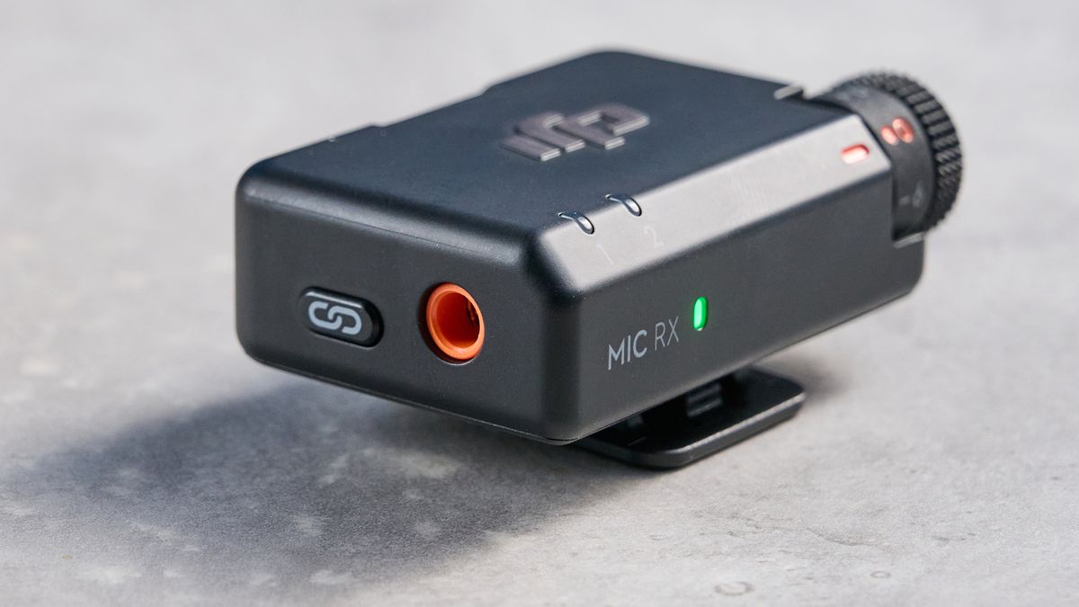 the dji mic mini 2 for camera and smartphone conent creators photographed against the blue tom's guide background