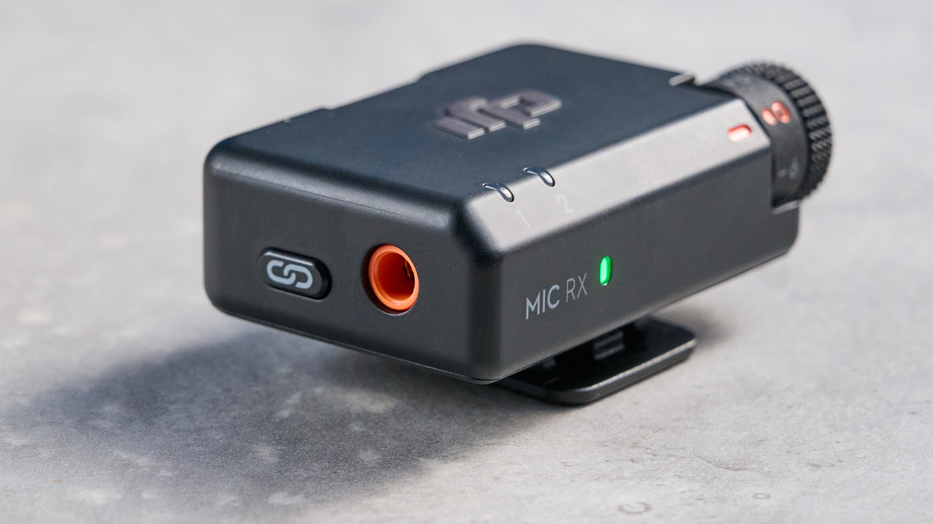 the dji mic mini 2 for camera and smartphone conent creators photographed against the blue tom's guide background