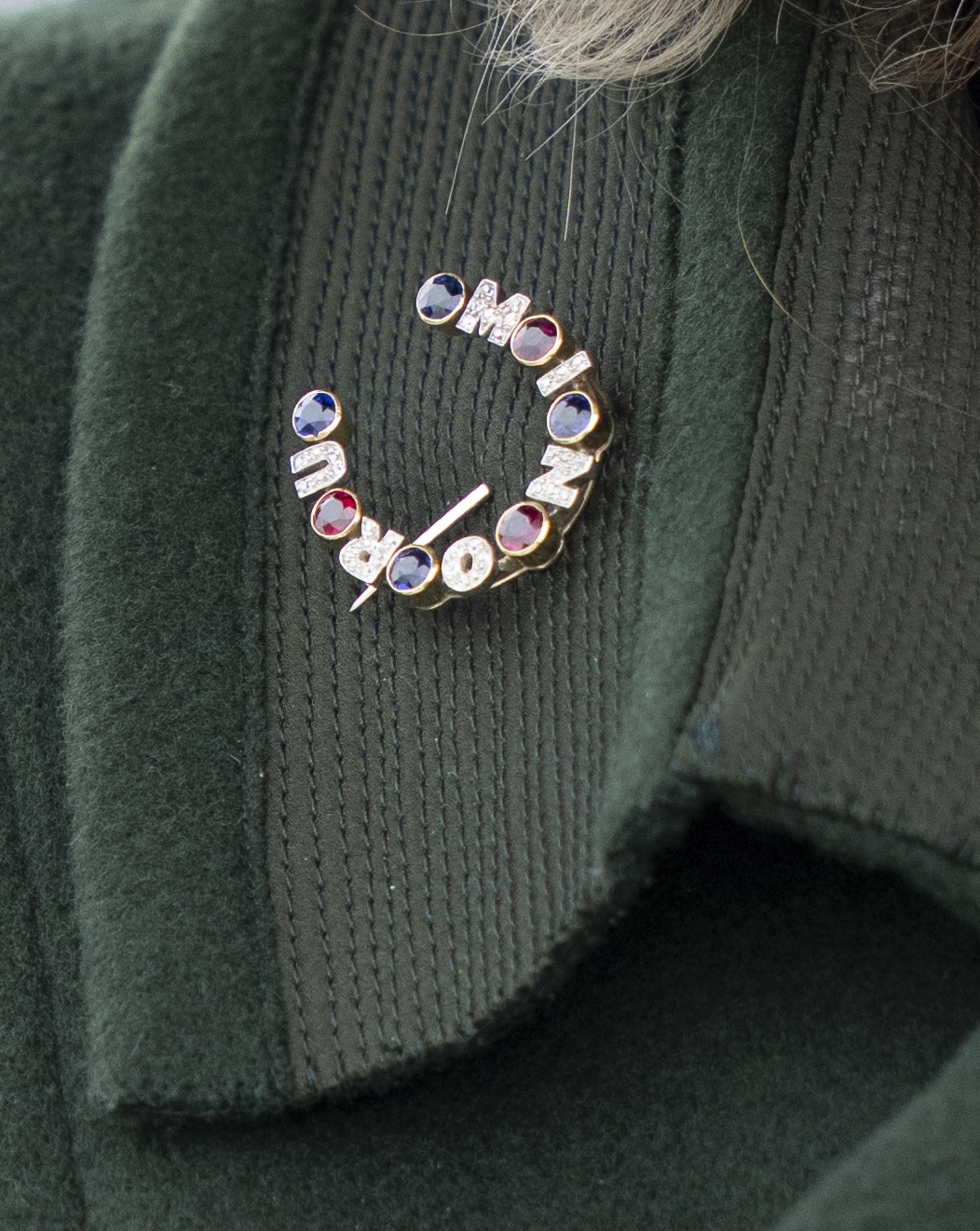 Detail of Queen Camilla's horseshoe brooch