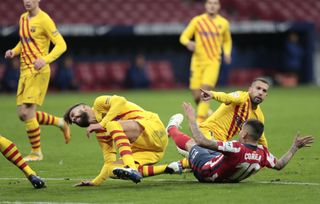 Barcelona defender Gerard Pique (left) was forced off injured following an awkward fall