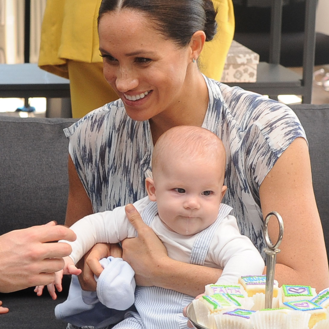 Meghan Markle cradles Prince Archie while Prince Harry fusses over him