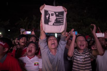 Supporters of Myanmar opposition leader Aung San Suu Kyi celebrate her landslide victory
