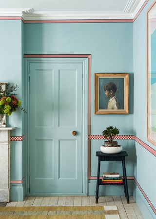 blue living room door with red trim around the edge