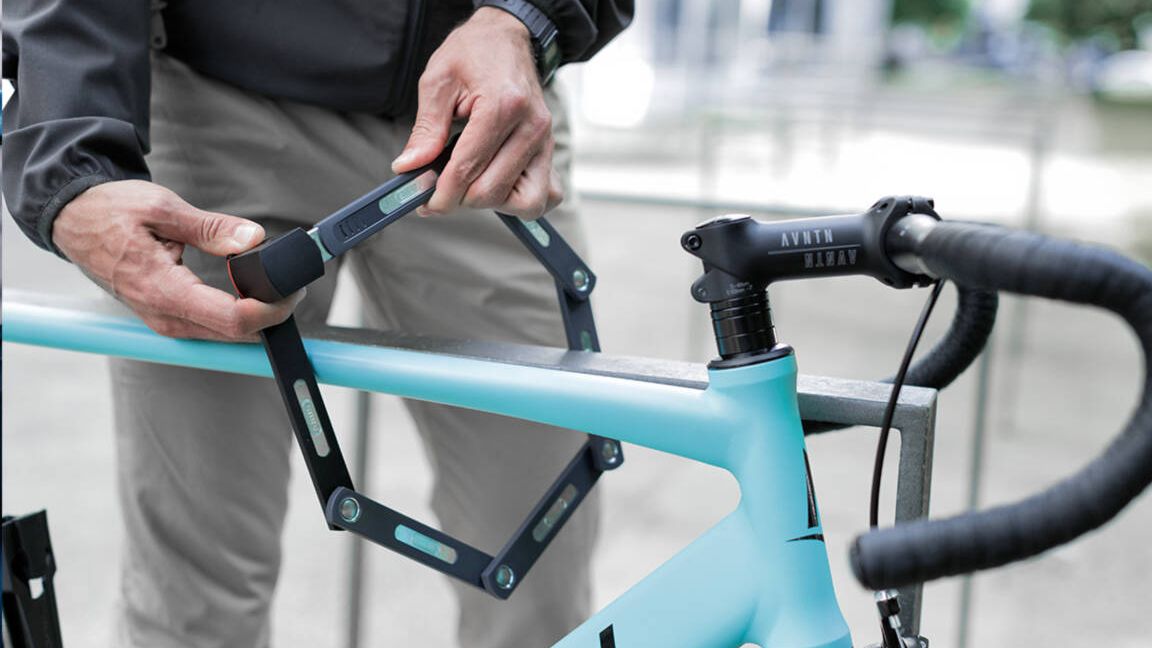 Best bike lock: Pictured here, a person chaining his bike to a railing