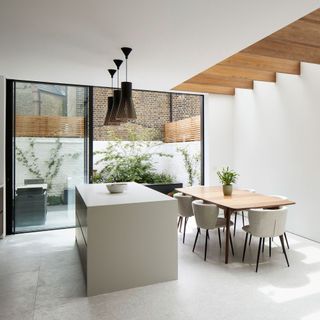 contemporary kitchen extension with kitchen island and dining table