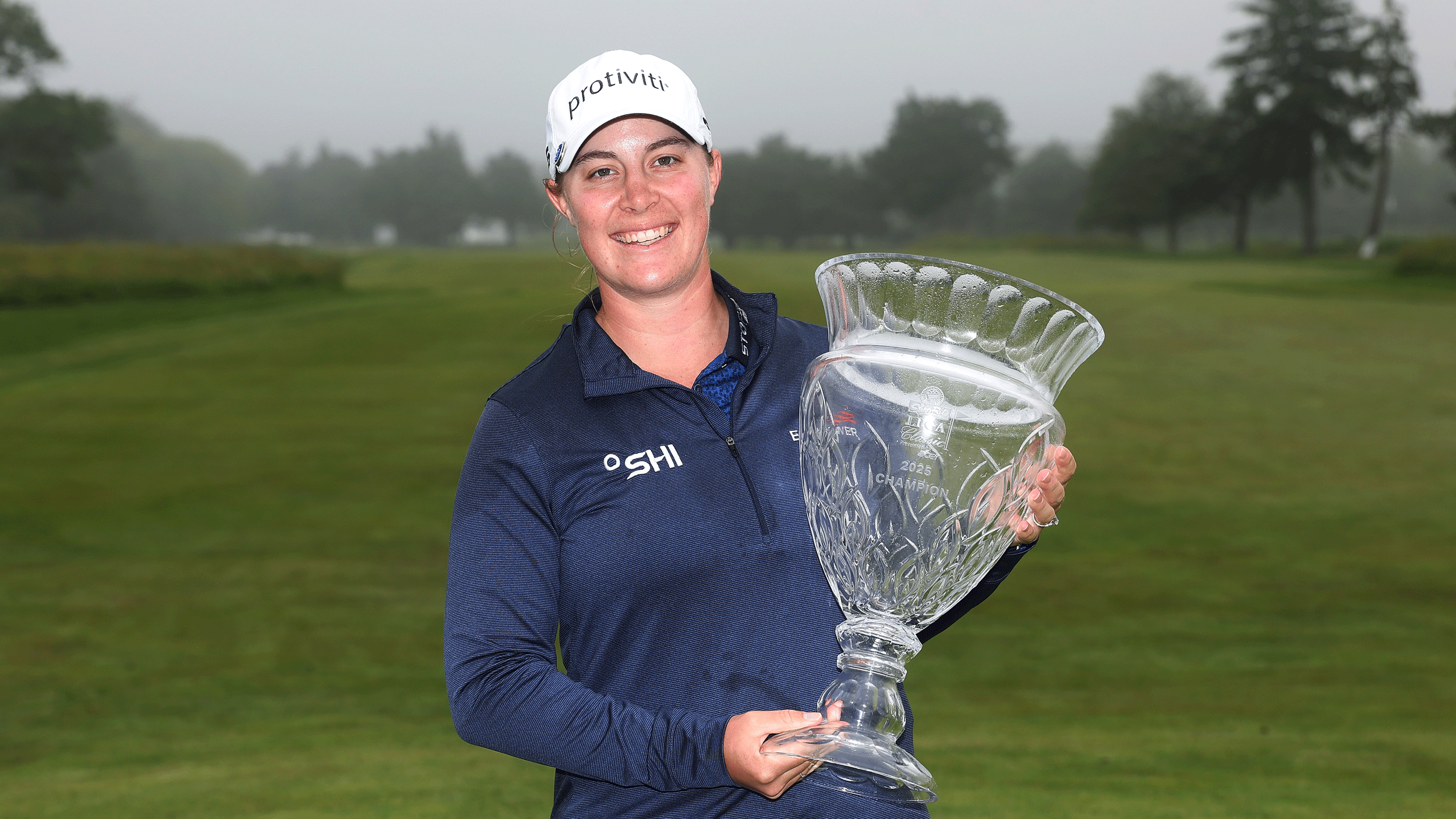 Jennifer Kupcho holds the ShopRite LPGA Classic trophy following her win in 2025