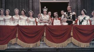 Queen Elizabeth II and the Duke of Edinburgh wave at the crowds from the balcony of Buckingham Palace in London, after Elizabeth's coronation