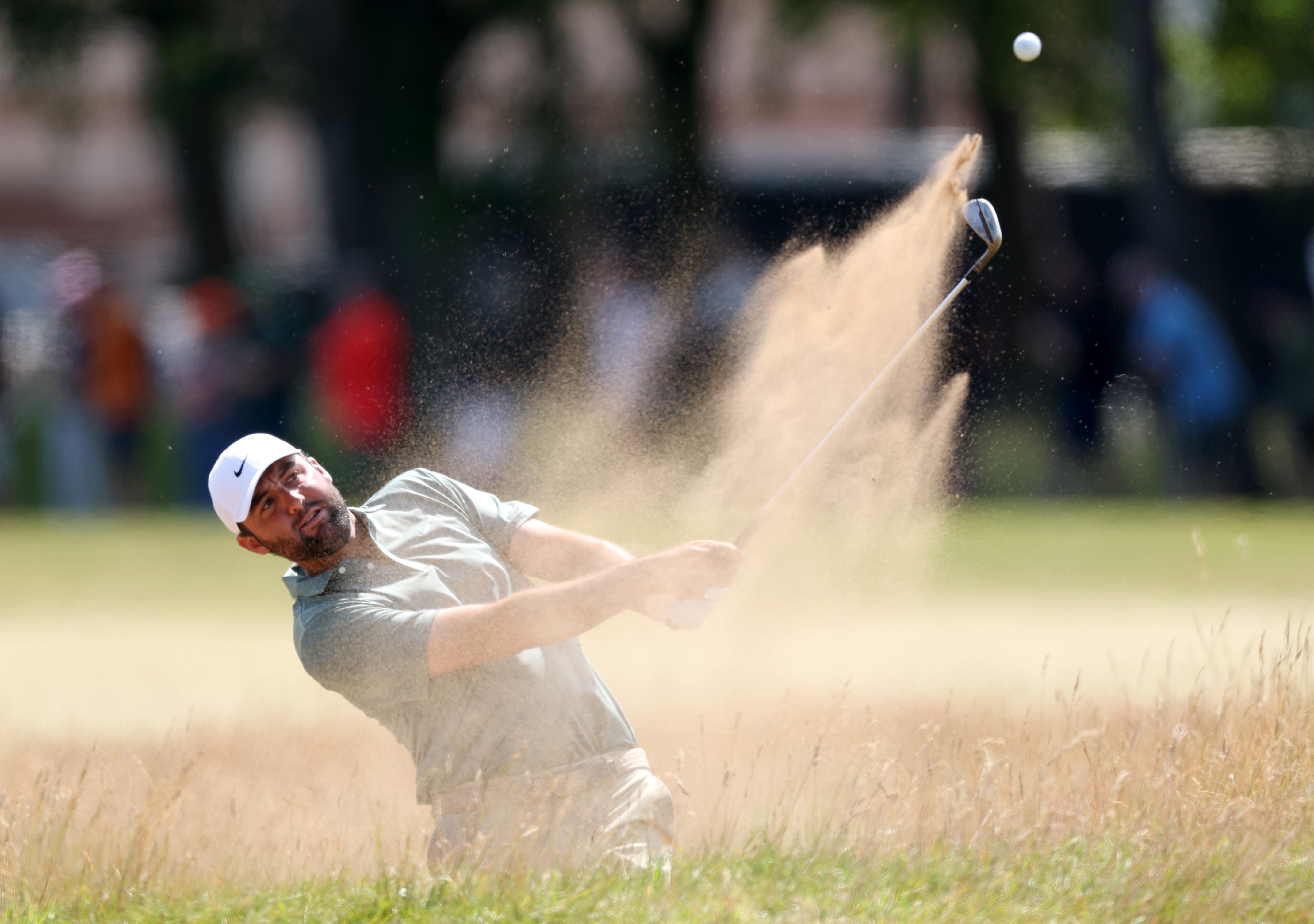 Scottie Scheffler hits a bunker shot