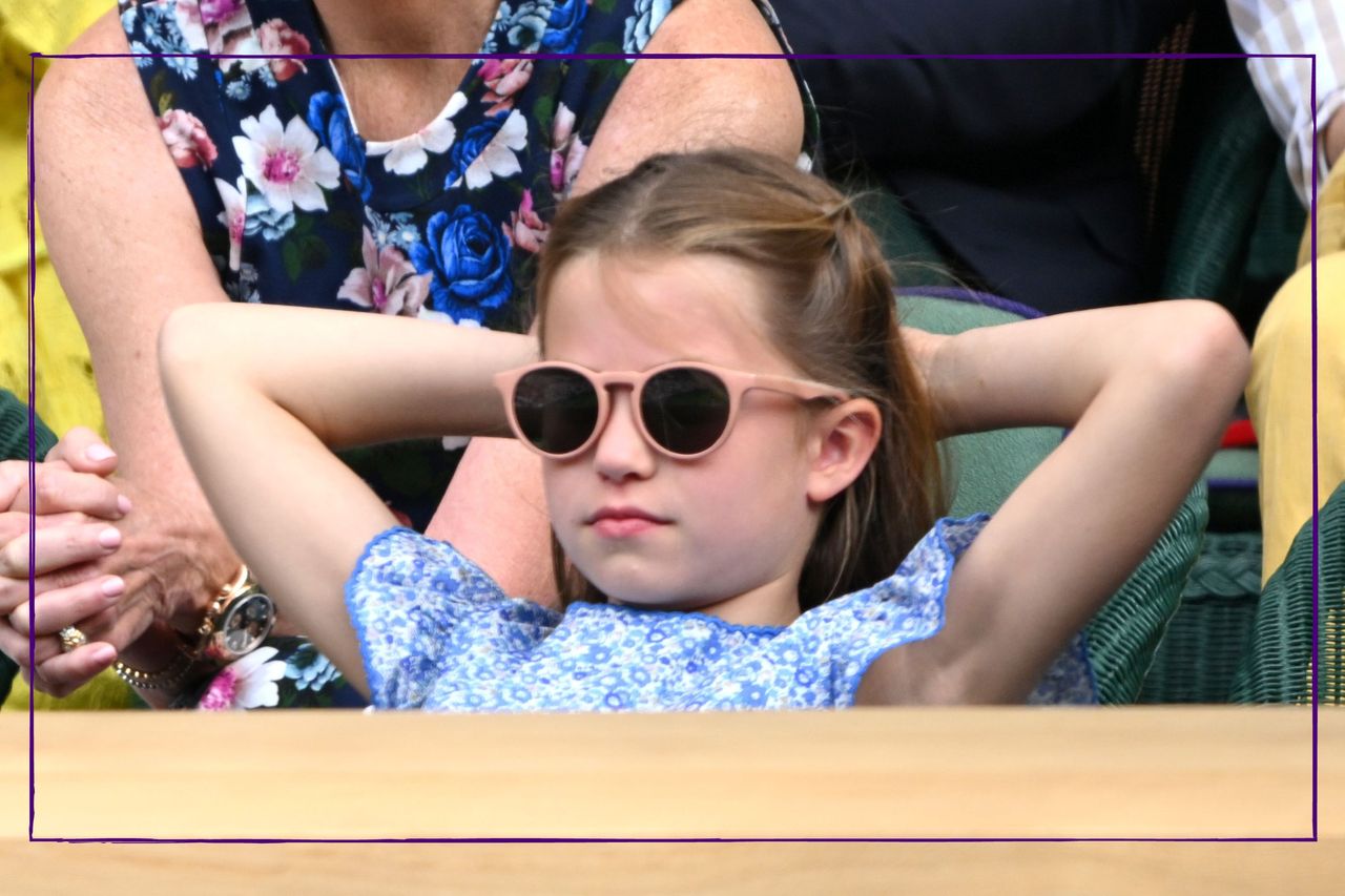 Princess Charlotte hands behind her head at Wimbledon