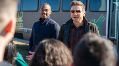 Anthony Mackie and Jeremy Renner greet the crowd at the reveal of the Big Brothers Big Sisters vehicle in Reno