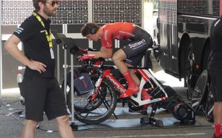 Team Sunweb's Chad Haga warms up in the shade ahead of his effort