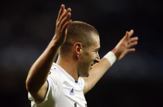 Karim Benzema celebrates after scoring his third goal for Real Madrid against Auxerre in the Champions League in December 2010.