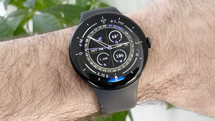 Close-up of the Google Pixel Watch 4 in black on a black strap