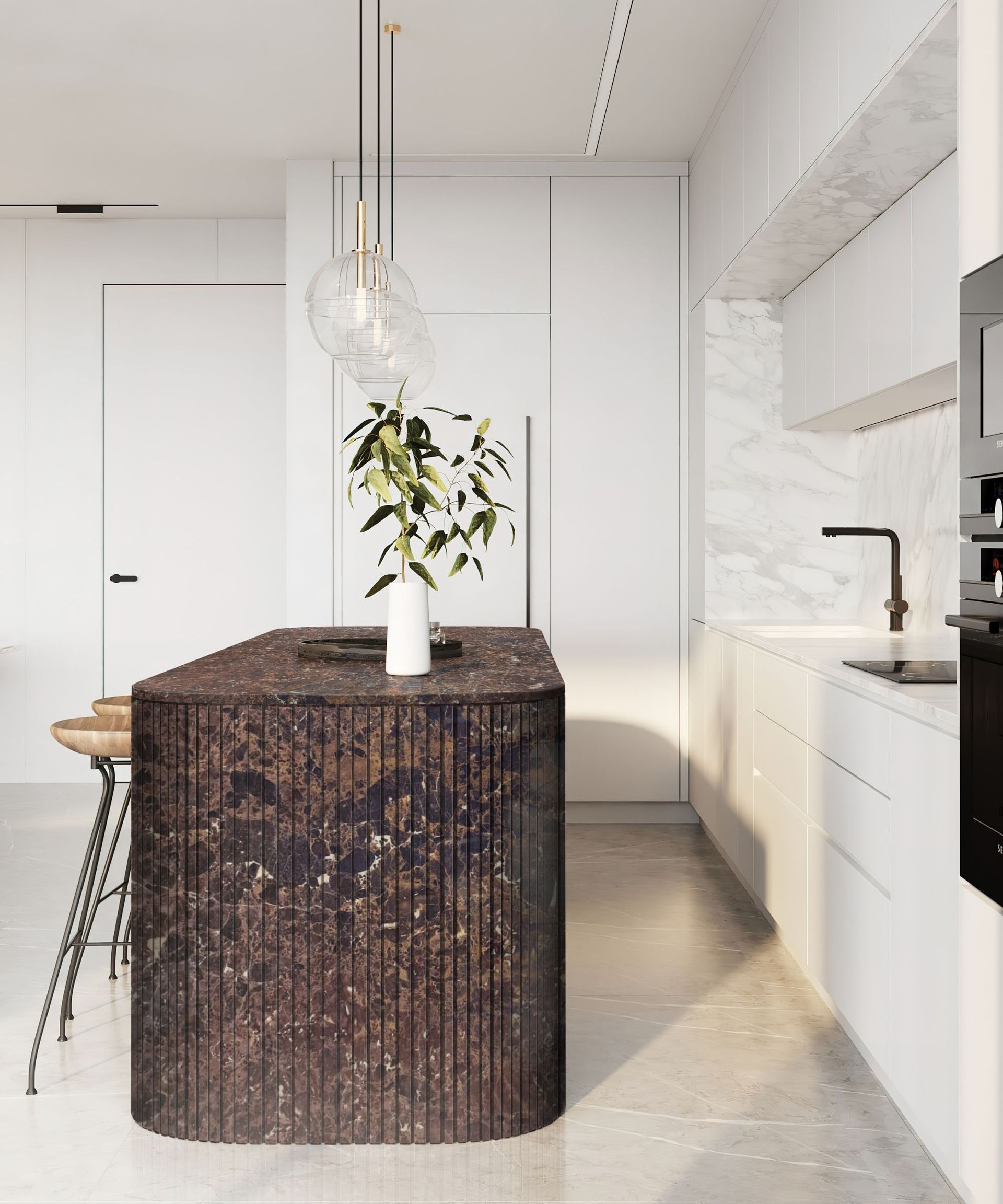 A white kitchen with a dark brown marble island