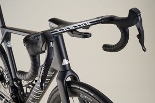 Canyon Ultimate CFR AXS Black road bike on grey background