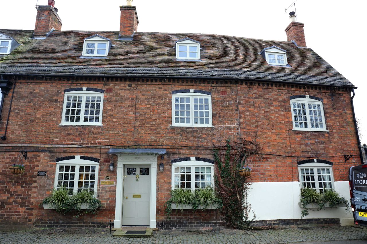 Brook house with windows and doors