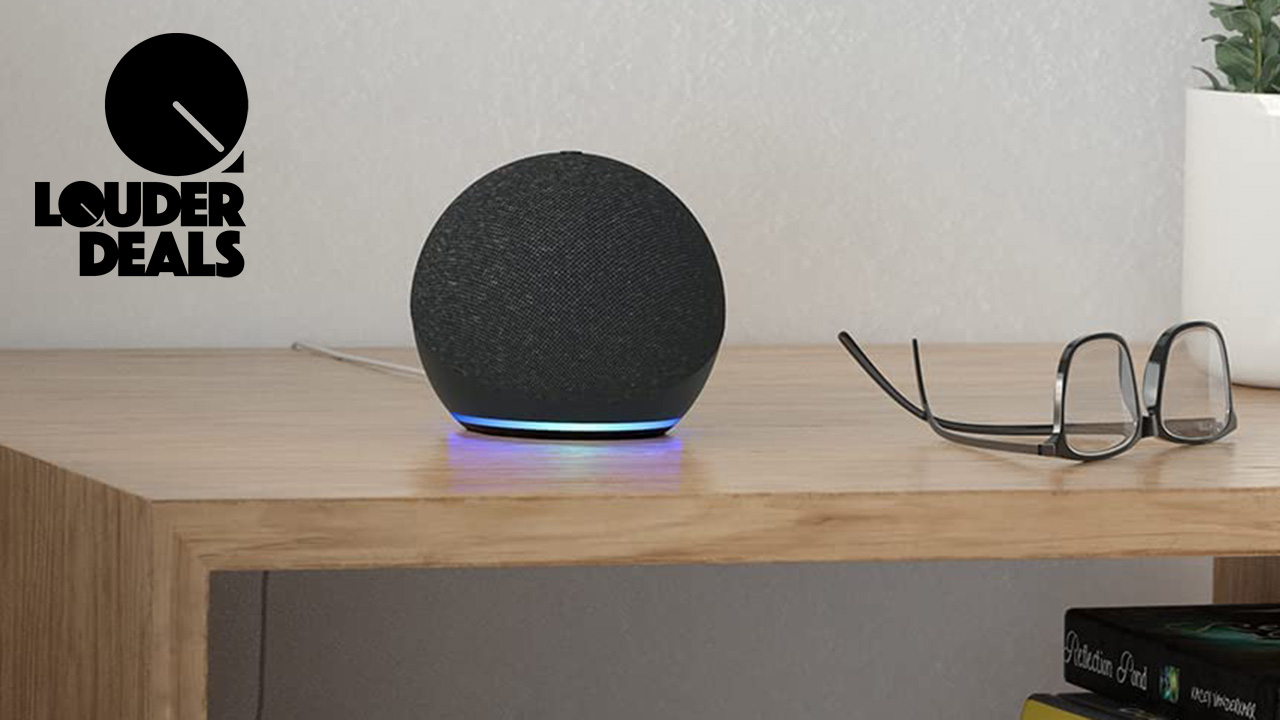 Amazon Echo Dot 4th Gen on a table beside a pair of glasses