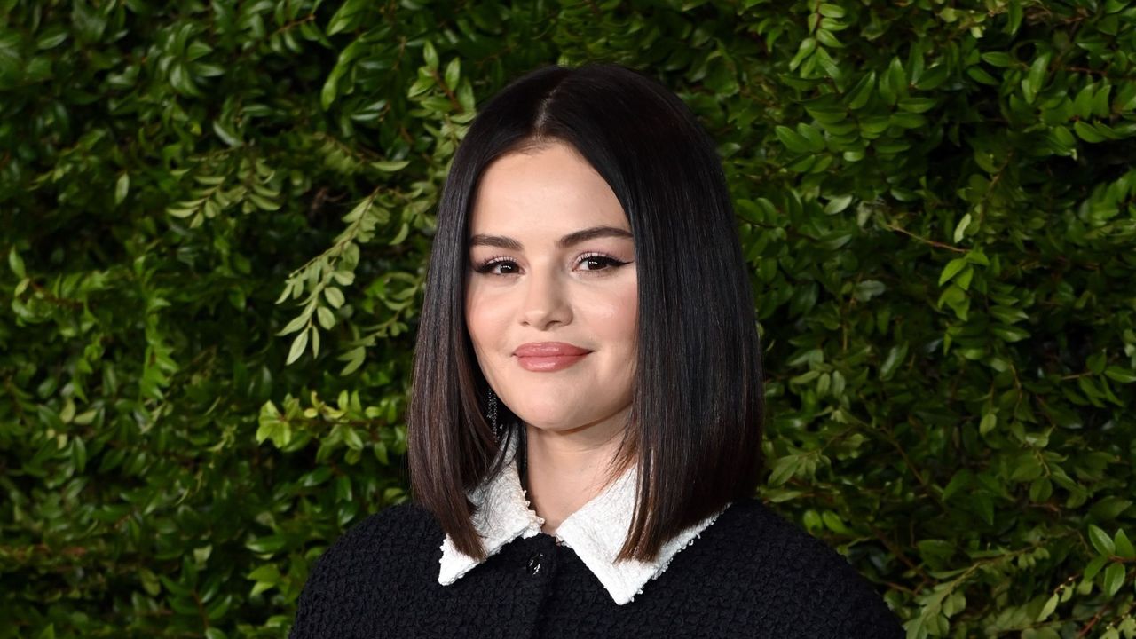 Selena Gomez posing at a Chanel event