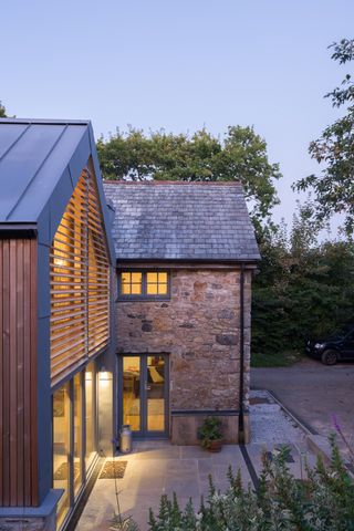 extension with a small porch and clever lighting