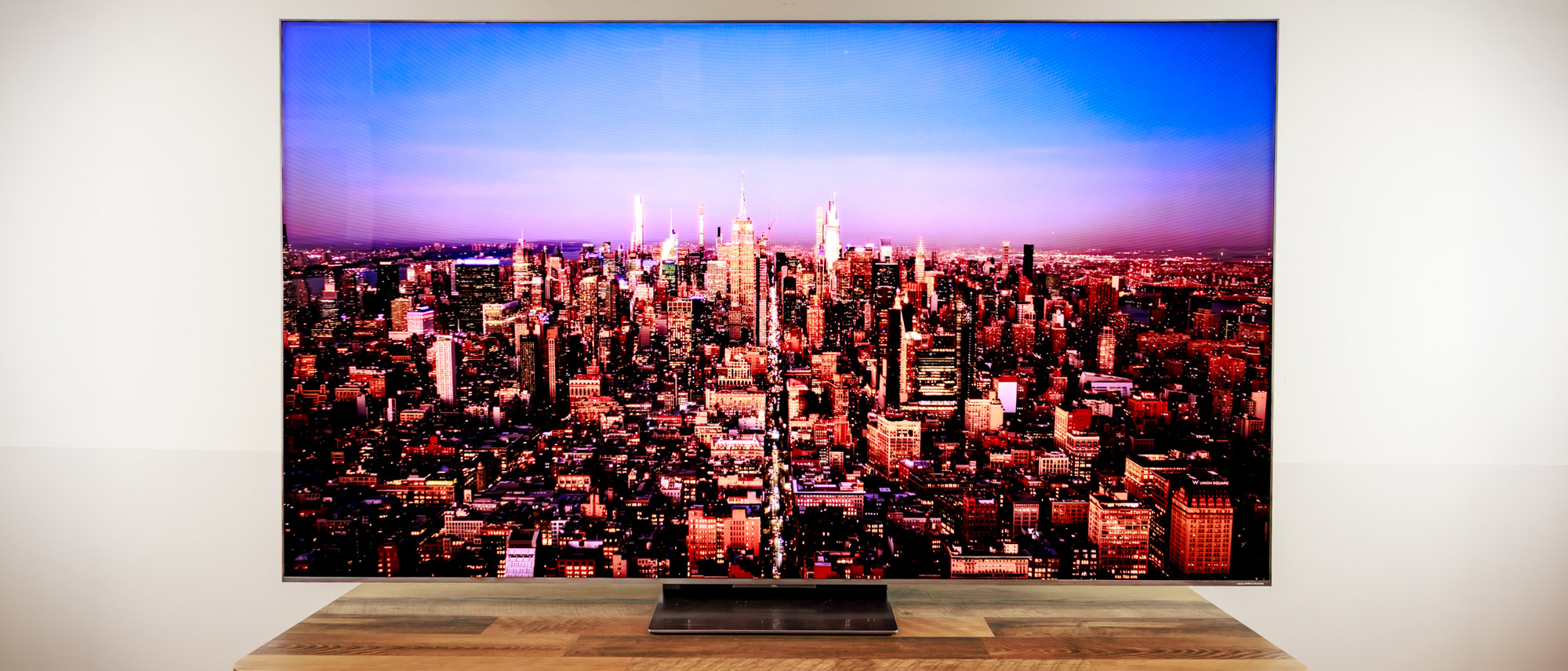 A TCL QM8L TV on a desk