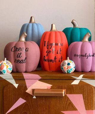 Colorful painted slogan pumpkins