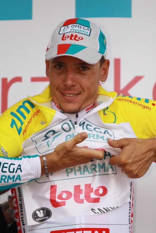 Race winner Philippe Gilbert (Omega Pharma-Lotto) dons the yellow jersey.