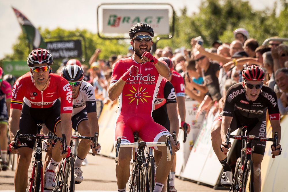 Nacer Bouhanni salutes Muhammad Ali as he crosses the line to win stage 1 at Criterium du Dauphine