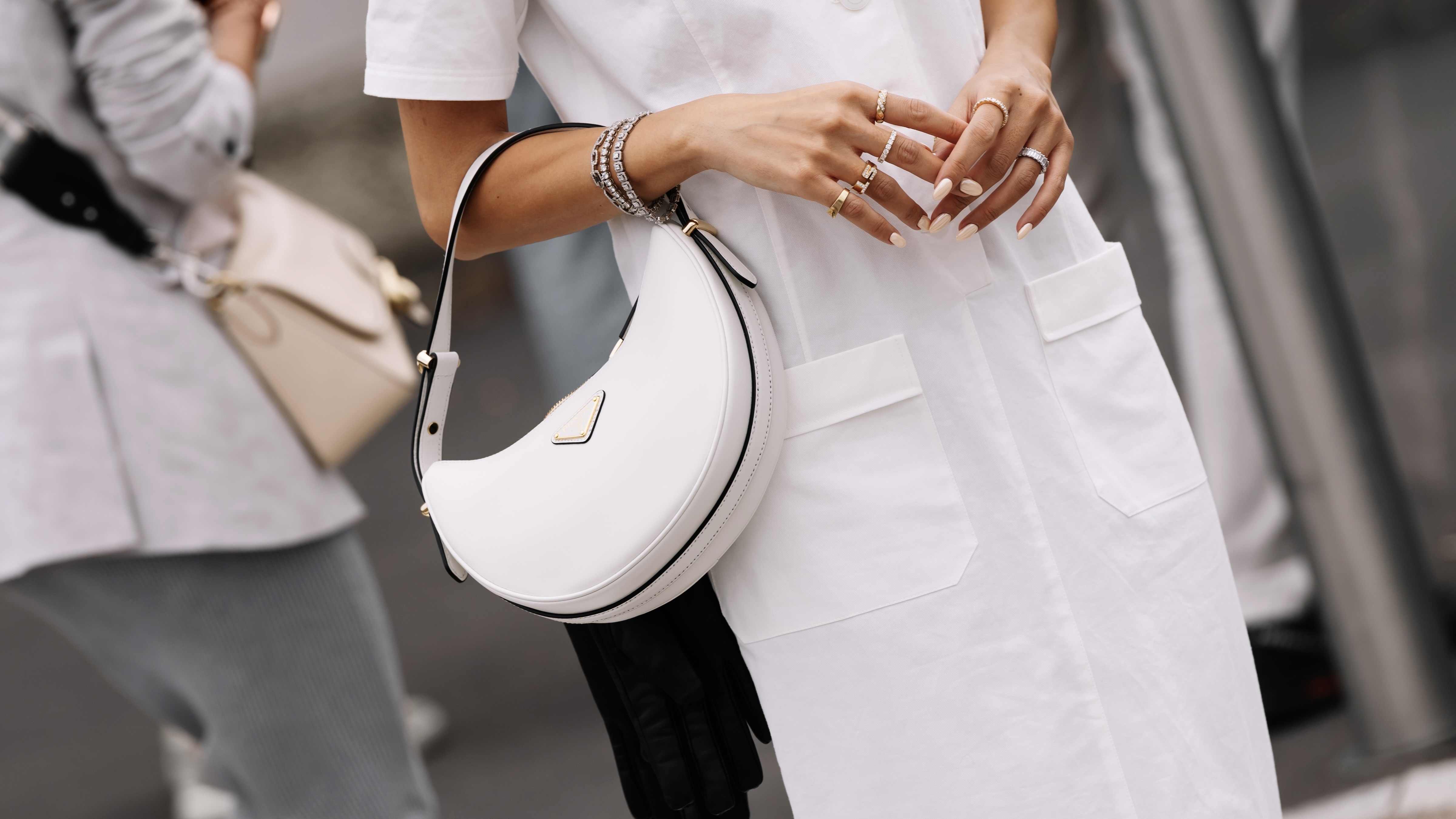woman in white wearing prada bag
