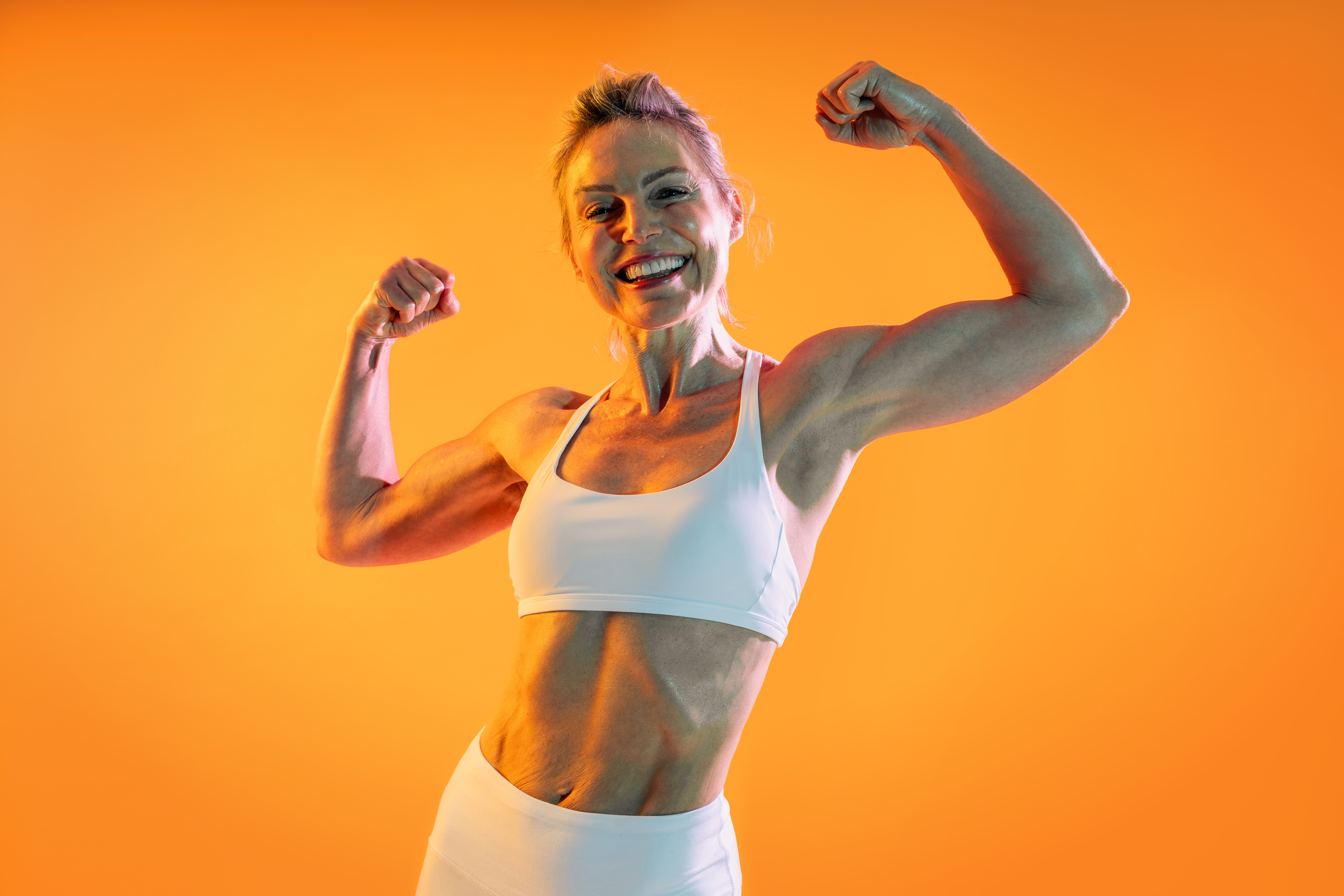 a woman flexing her arm muscles