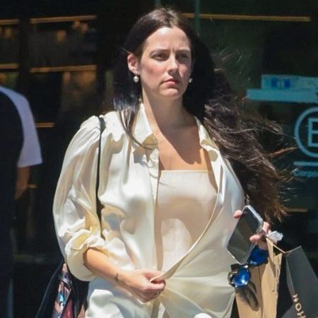 Riley Keough keeps it effortlessly chic during Erewhon stop in Calabasas wearing a cream silk top and camisole and taupe pliss&eacute; pants.