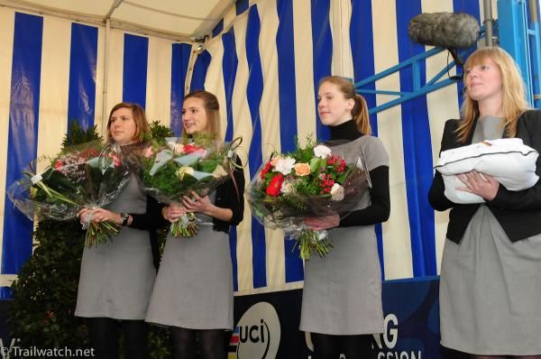 The presenters with their flowers and medals