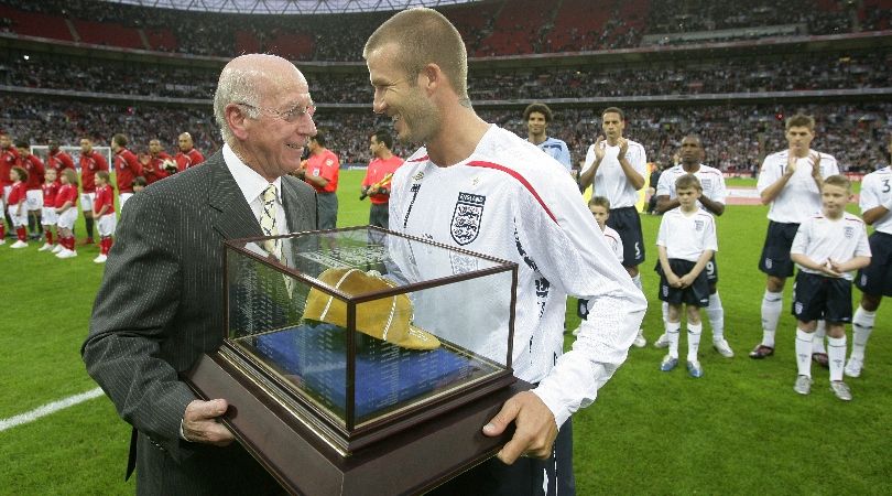 Sir Bobby Charlton presents David Beckham with his 100th England cap.