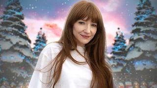 Nicola Roberts headshot against a snowy background with trees