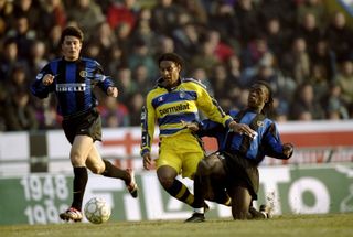 Parma's Ousmane Dabo is tackled by Inter's Clarence Seedorf in a Serie A match in February 2000.