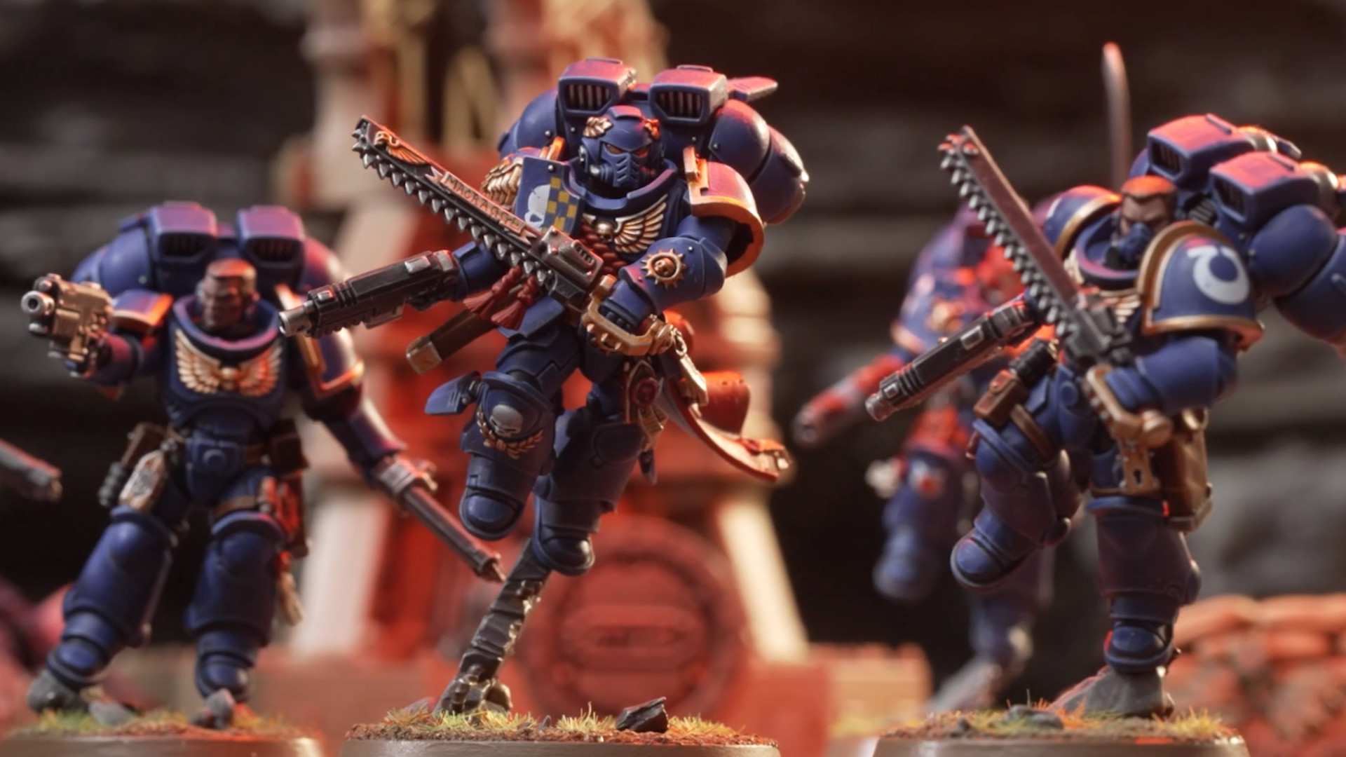 Warhammer 40,000 Space Marine Jump Pack unit makes its way across the battlefield, chainsaws drawn