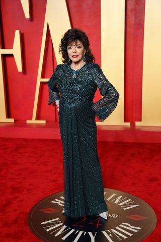 Dame Joan Collins on the red carpet at the Vanity Fair 2024 Oscar Party