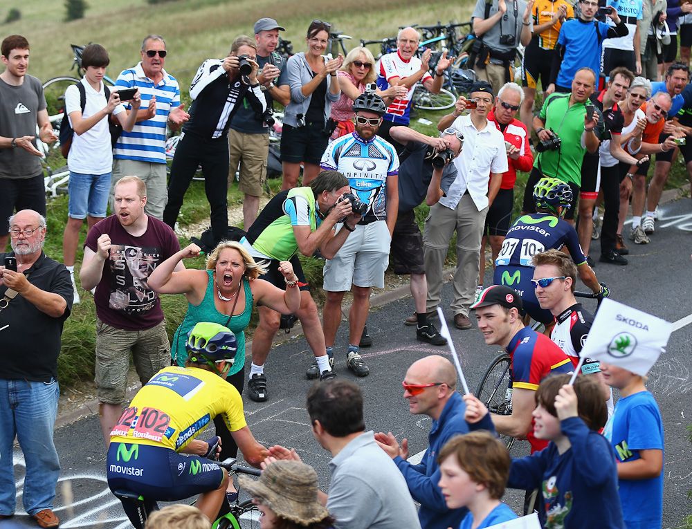 Fans cheer race leader Alex Dowsett of Great Britain and Team Movistar as he rides up Ditchling Beacon during stage seven of the 2014 Tour of Britain.