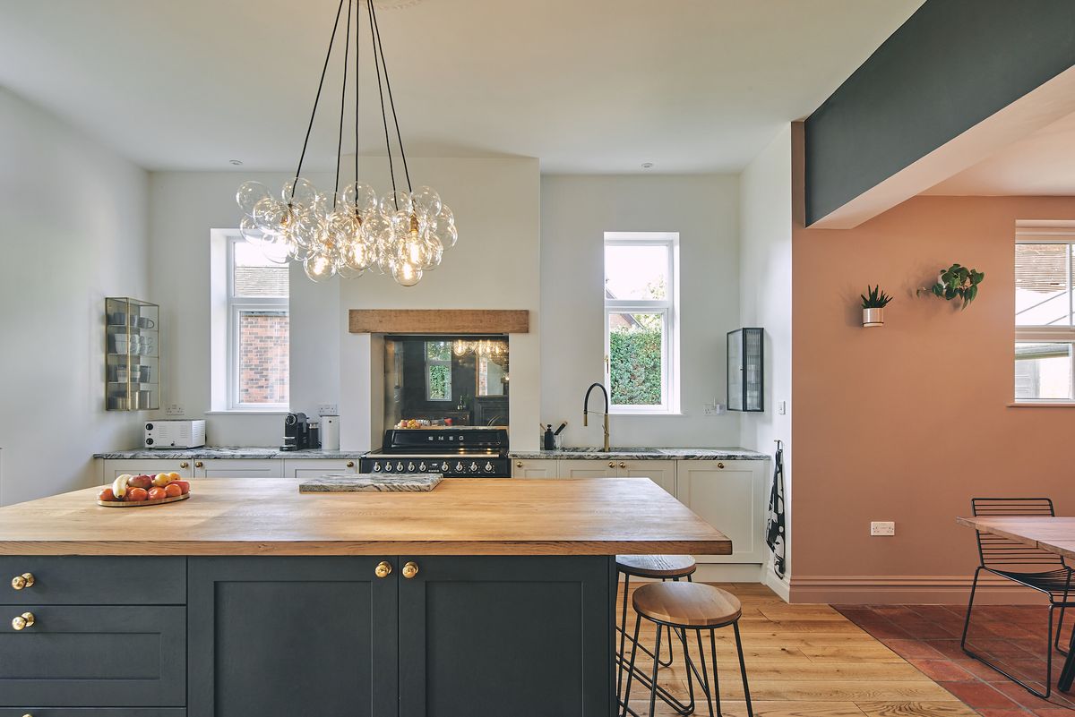 modern kitchen with island and smoked glass splashback
