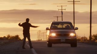 A man flagging down a car in Nocturnal Animals