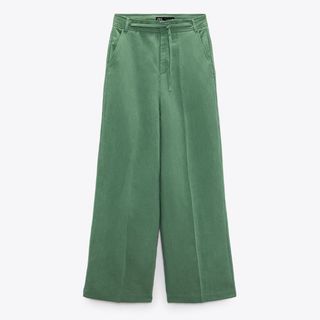 zara green linen trousers flat lay