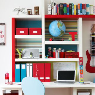 desk space with shelves storing books and folders