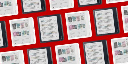 Many Kobo e-readers placed in front of a red background