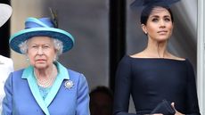 Queen Elizabeth II and Meghan, Duchess of Sussex on the balcony of Buckingham Palace as the Royal family attend events to mark the Centenary of the RAF on July 10, 2018