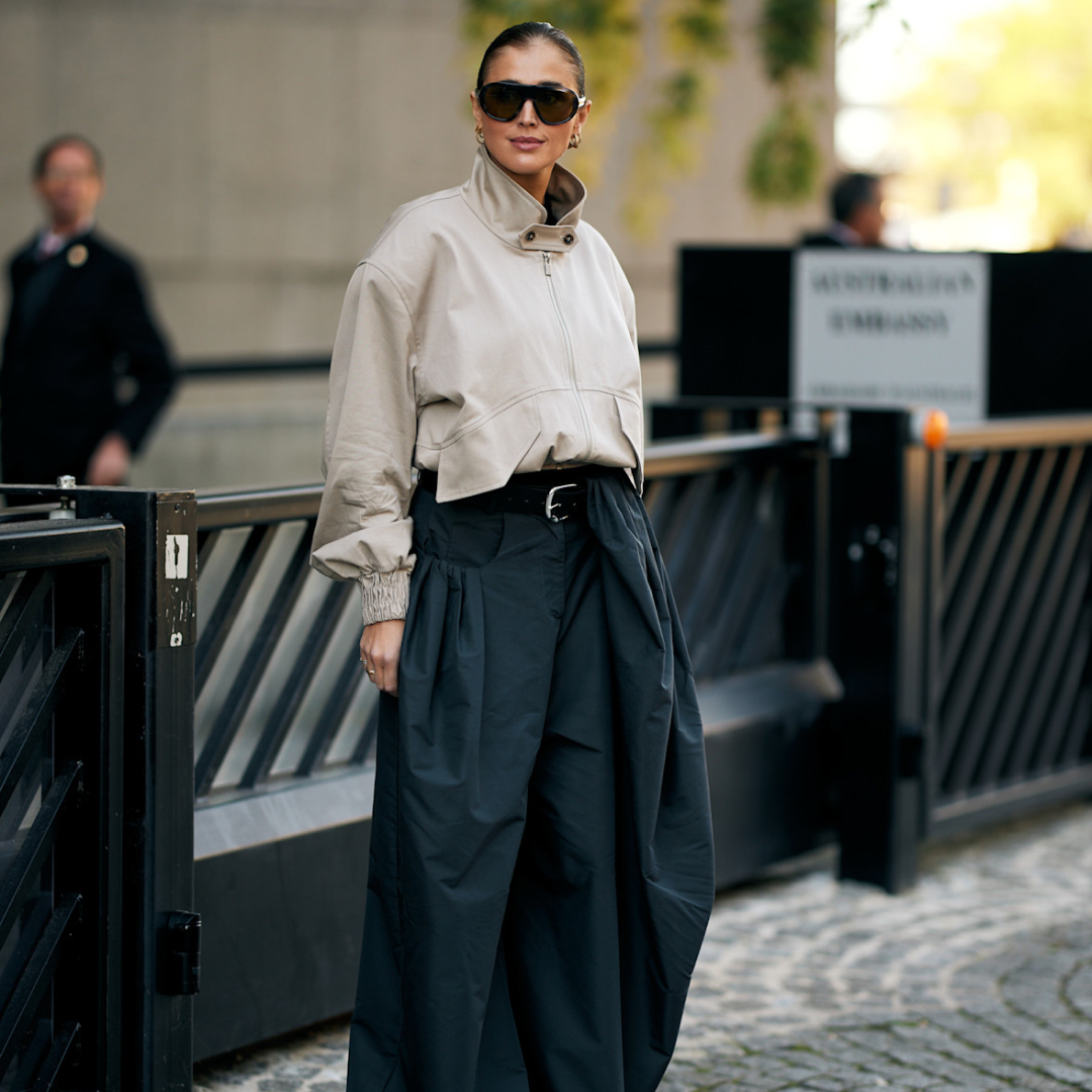a woman wearing wide leg pants