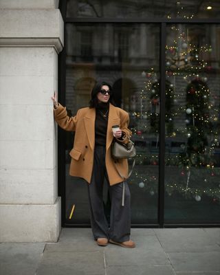 @francescasaffari wearing tailoring and Uggs